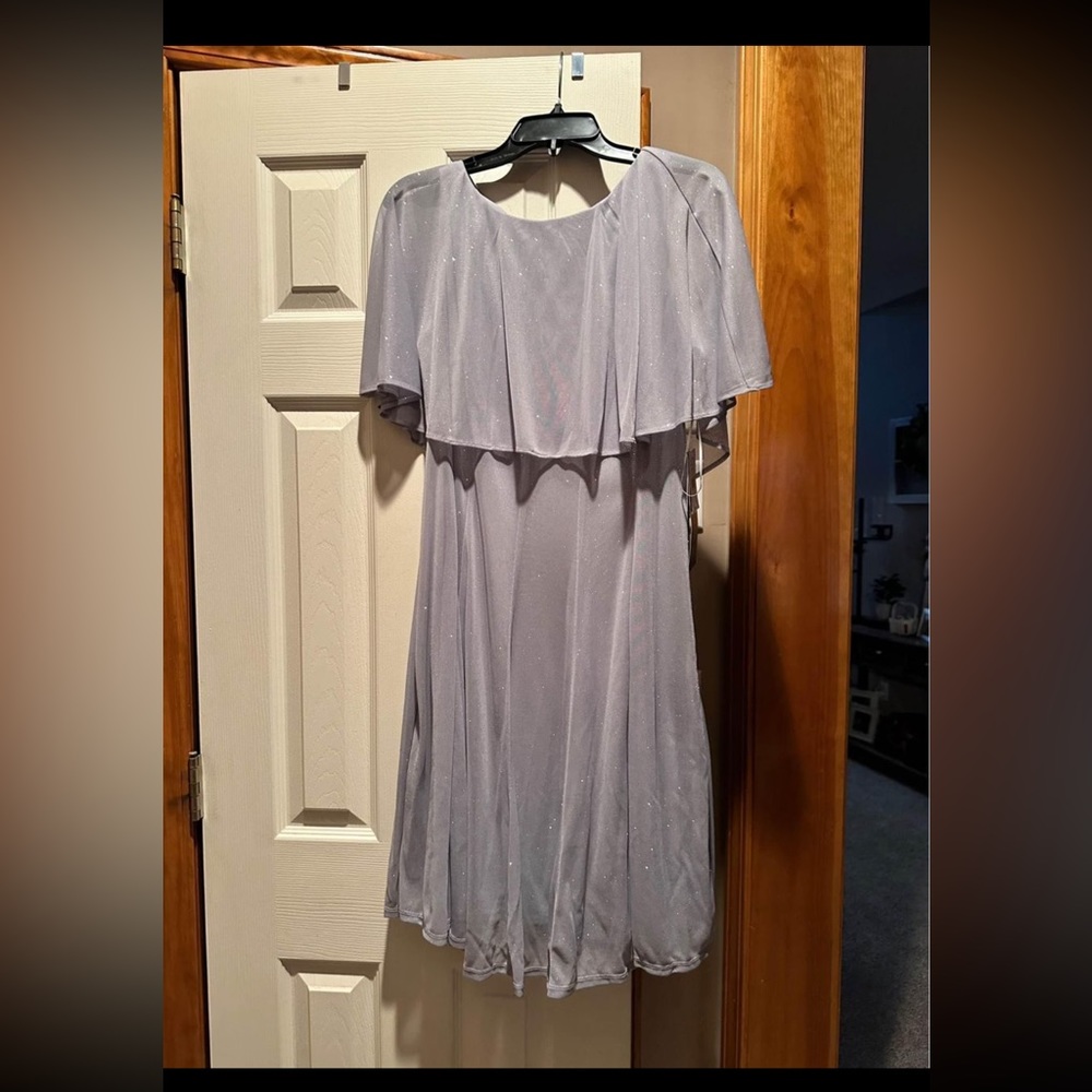 Sliver dress size 16.  Purchased for daughter’s wedding but never worn.